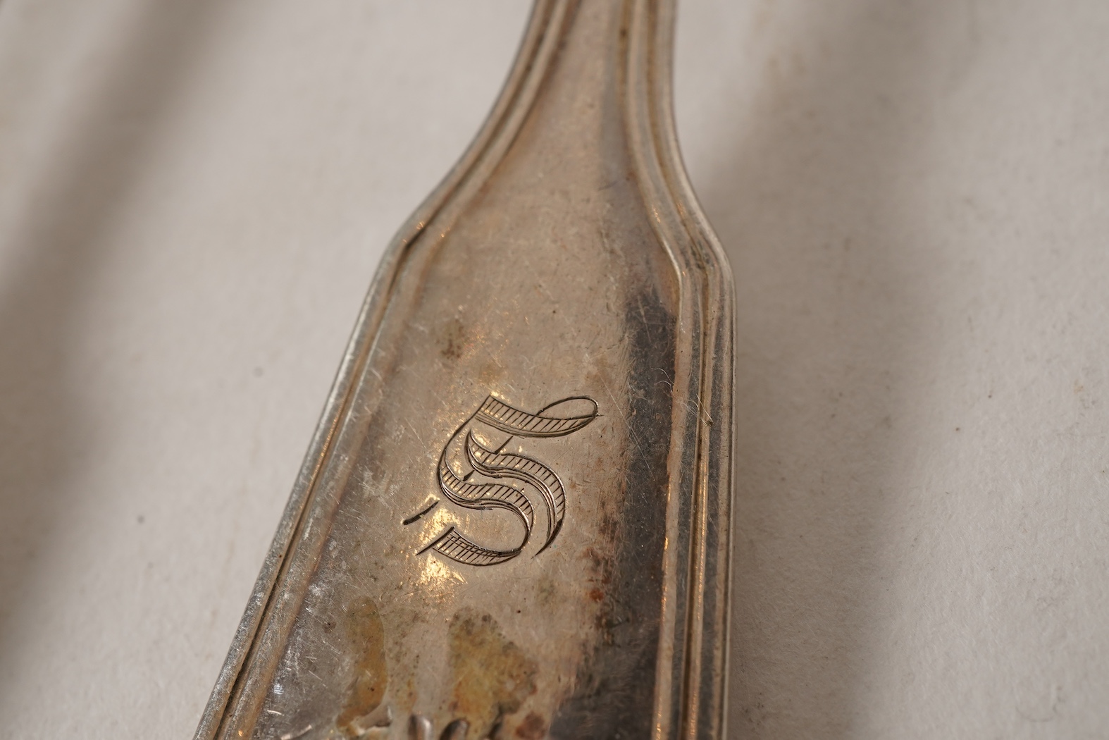 A matched part canteen of mainly 19th century silver double struck fiddle, thread and shell pattern flatware for twelve
